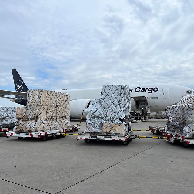 Air freight with airplane in the background