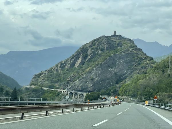 The motorway in the direction of Mont Blanc leads into a tunnel under a