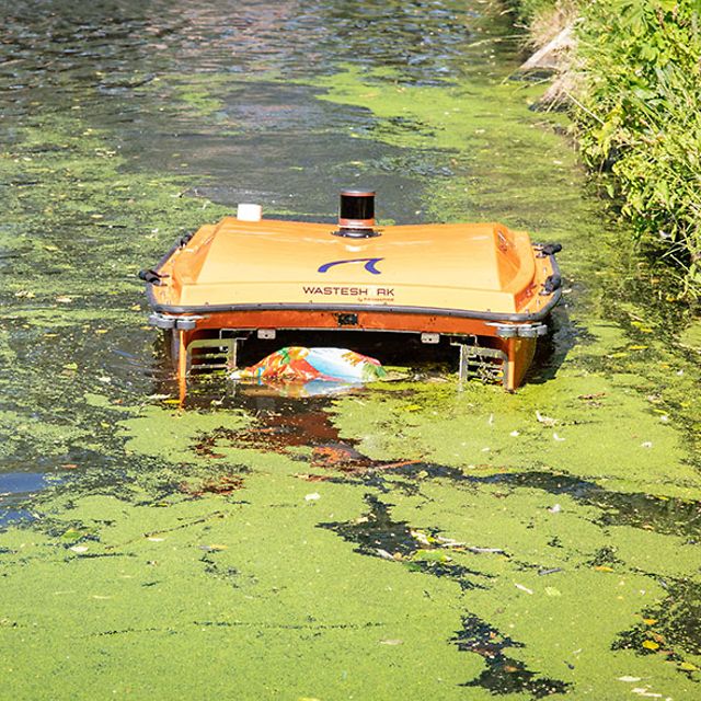 WasteShark from RanMarine collects plastic waste and algae from the surface of the water.