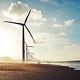 Wind turbines at sea generating sustainable energy as part of critical infrastructure.