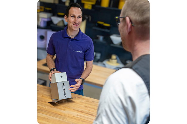Christian Behr, CEO of Sita, shows a customer the Varuna product