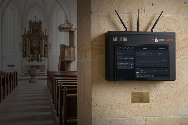 The interior of a church, with a digital IoT device on the stone wall.