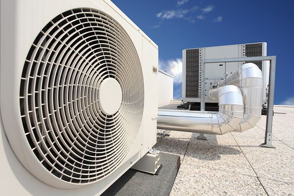 Close-up of a large air conditioning unit on a rooftop.