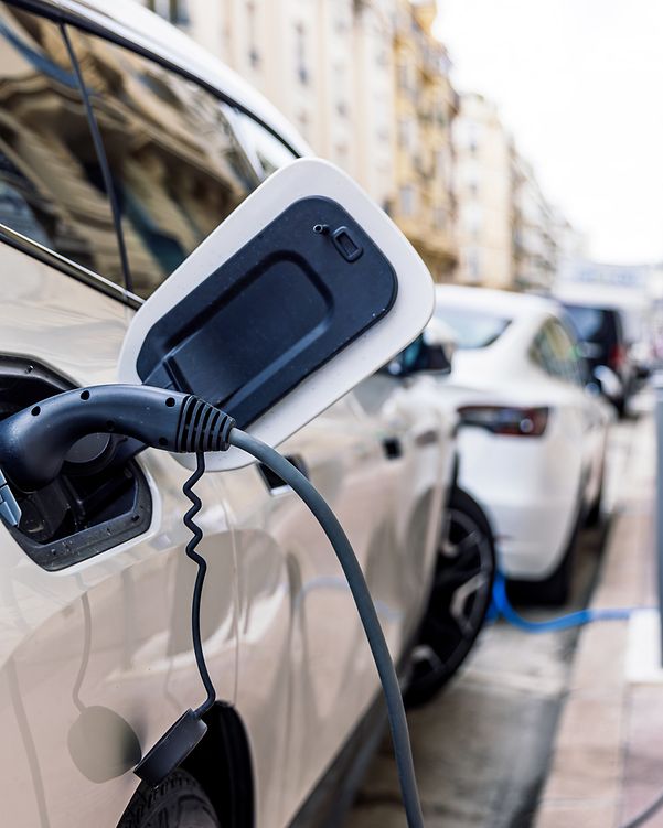 Electric car plugged in a loading station